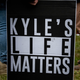 A person holds a sign that reads “Kyle’s Life Matters”, a reference to Kyle Rittenhouse, as several hundred members of the Proud Boys and other similar groups gathered at Delta Park in Portland, Oregon on September 26, 2020.